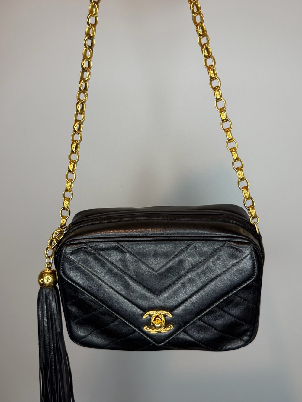 CHANEL Black Quilted Leather Crossbody Bag with Gold Chain & Tassel